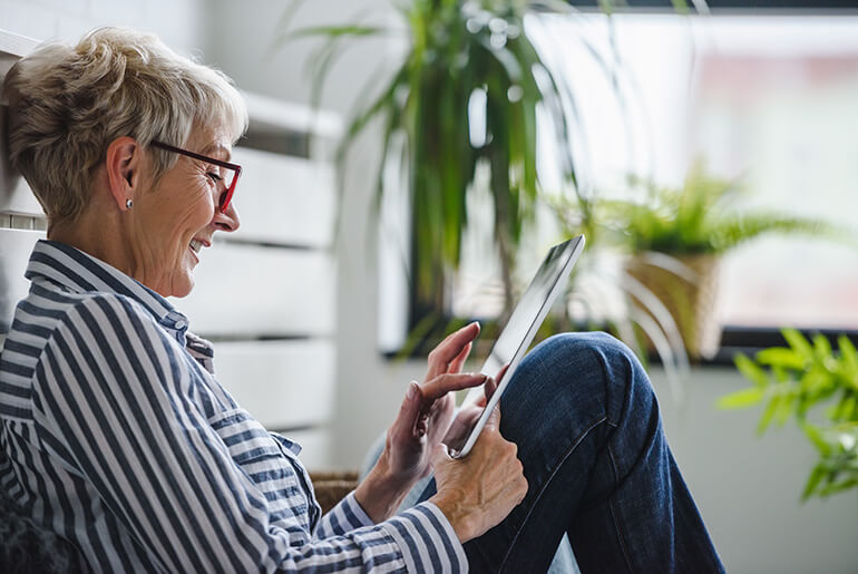 Woman Looking at Her Tablet